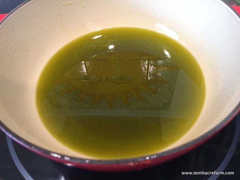 How to make herbal salve: Whisk until beeswax and oil are completely melted and mixed together.